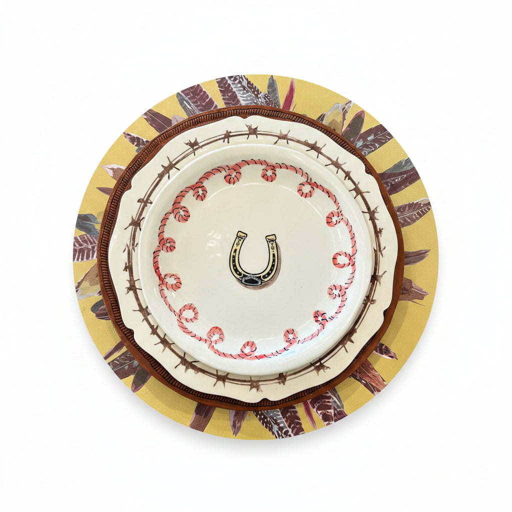 Decorative plate with a horseshoe design on a patterned background