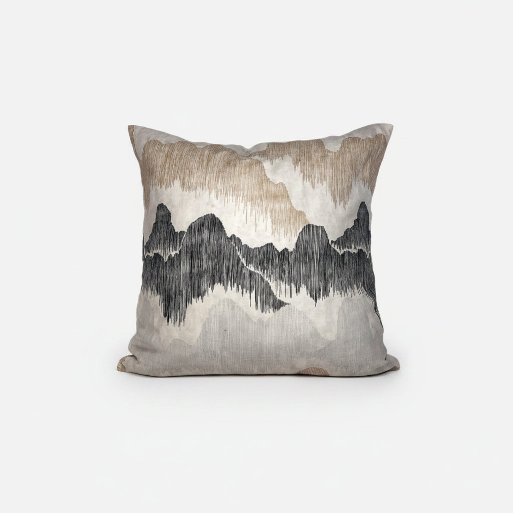 Decorative pillow with mountain landscape design on a white background