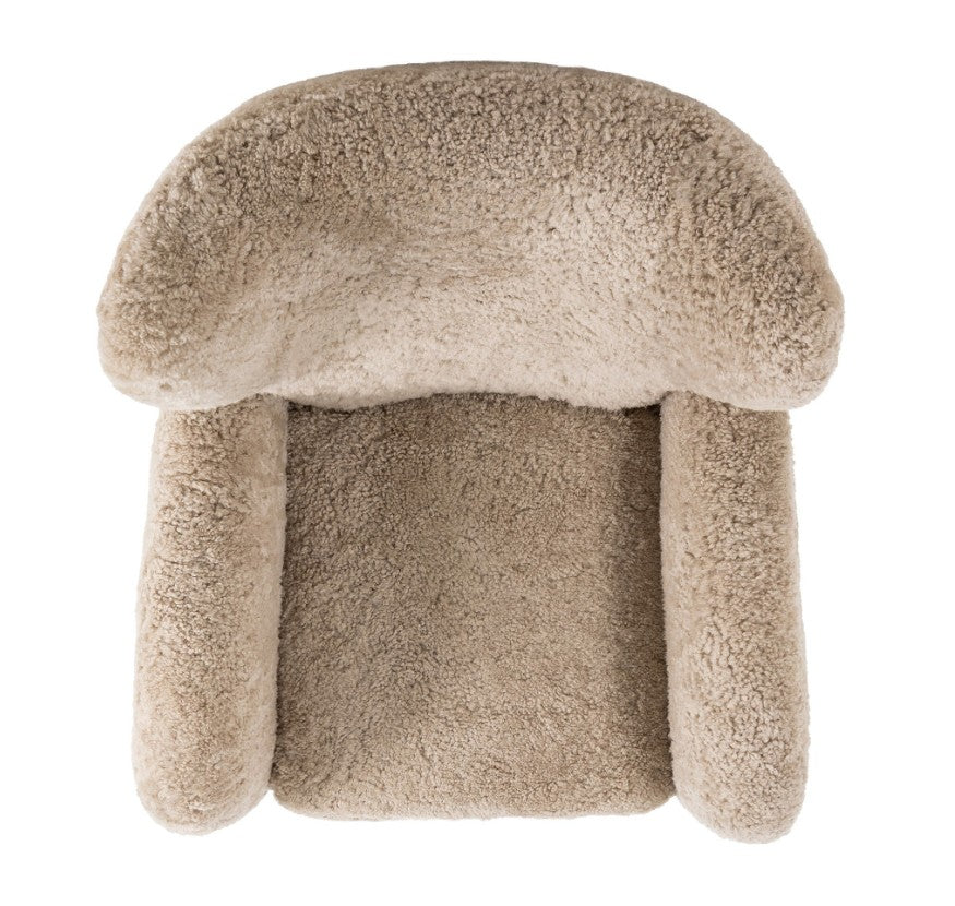 A plush, mushroom-shaped armchair upholstered in a soft, textured bouclé fabric in a warm taupe-beige color, shown against a solid white background.