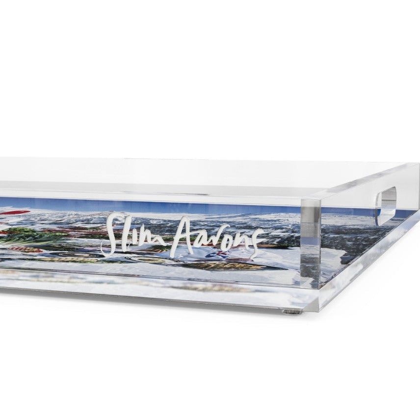 A clear acrylic serving tray with a printed scenic landscape design and the white script text 'Shiva Aarons' on the front, shown on a plain white background.