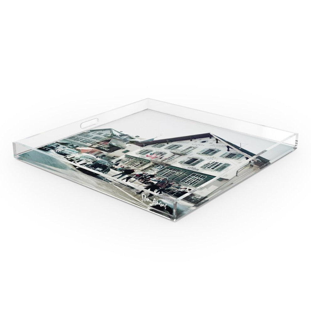 A square clear acrylic serving tray with integrated handles and a printed black-and-white street scene on the bottom, shown on a plain white background.