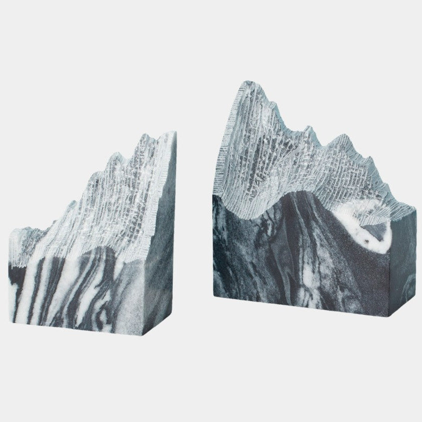 Marble-patterned bookends on a light gray background