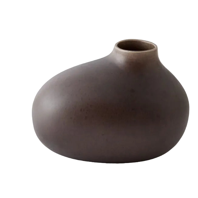Brown ceramic vase on a light gray background