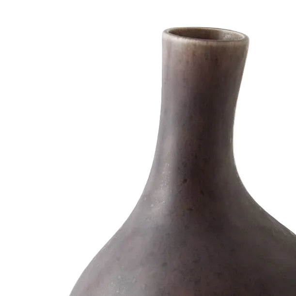 Dark brown ceramic vase on a light gray background