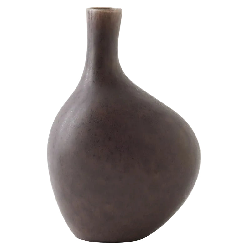 Brown ceramic vase on a light gray background