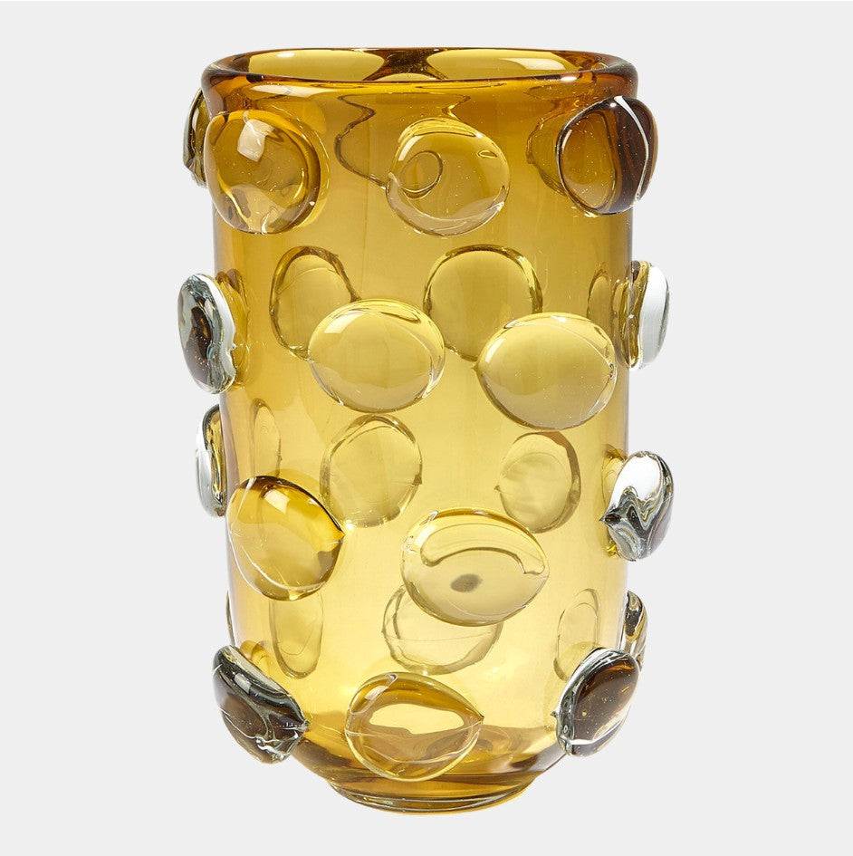 Yellow glass vase with bubble design on a white background