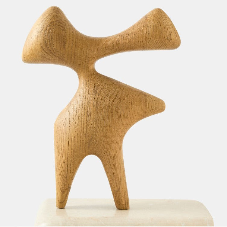 Wooden abstract sculpture on a white background