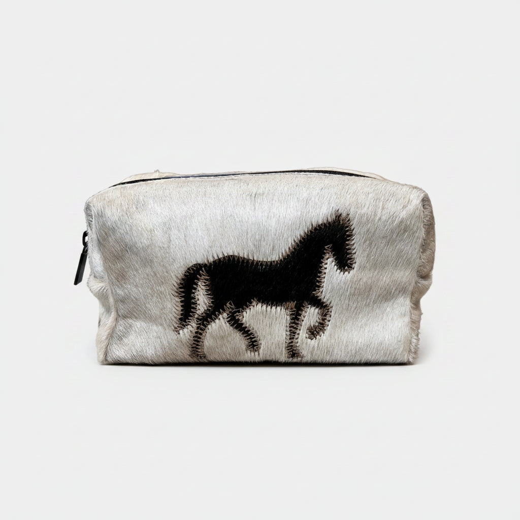Clutch bag with cowhide texture and horse silhouette on a white background