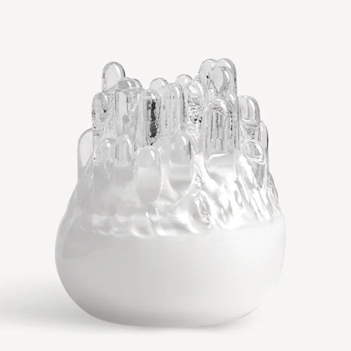 White ceramic vase with textured surface on a white background