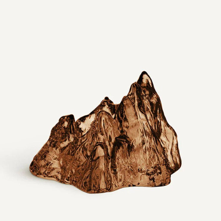 Glass votive sculpture in shape of a the Teton mountains