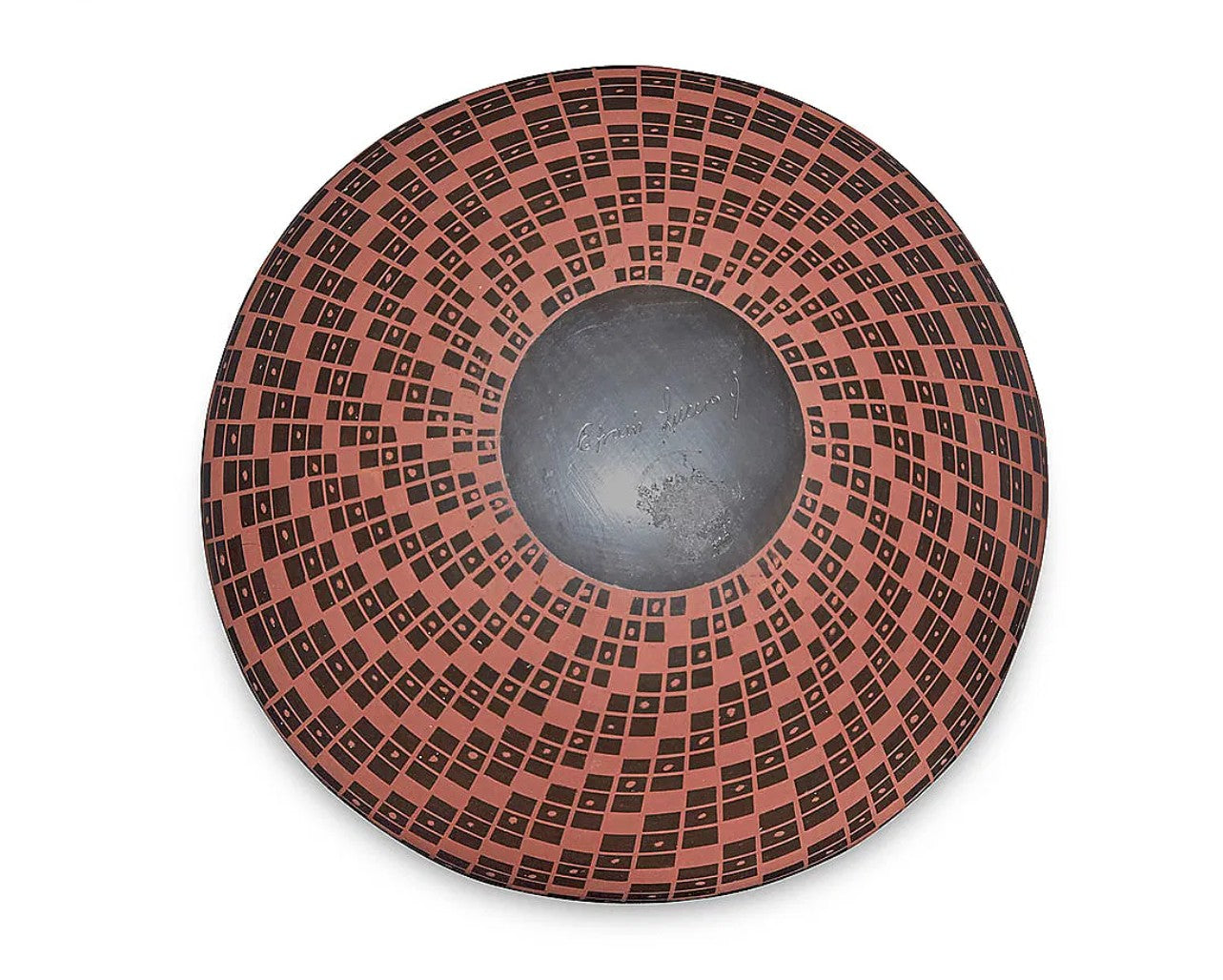 A round ceramic bowl with a wide rim, featuring a terracotta-colored and black geometric checkerboard pattern around the exterior and a smooth, dark gray glazed center.