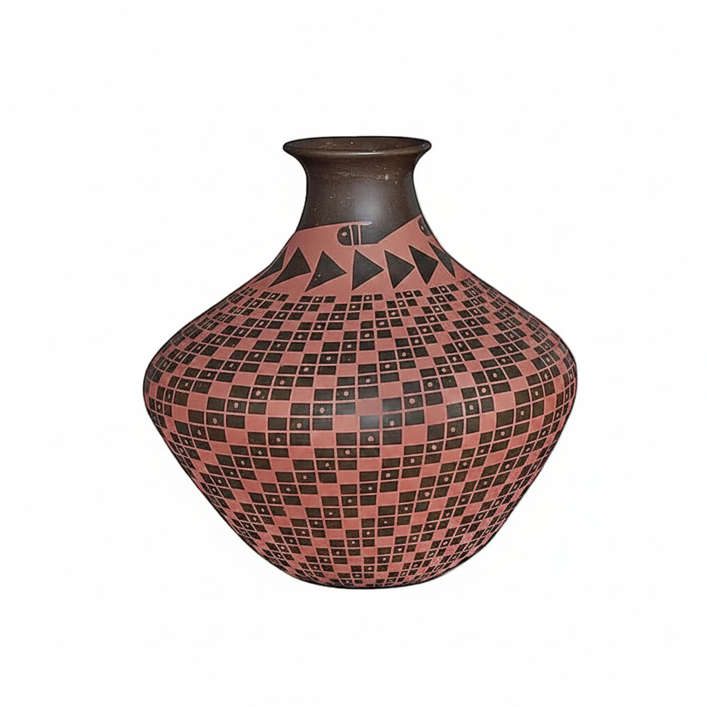 A handcrafted ceramic vase with a wide, rounded body, a narrow neck, and a patterned surface featuring a checkerboard design in terracotta and black, with geometric triangle motifs near the neck. A second vase is partially visible on the right edge of the frame.