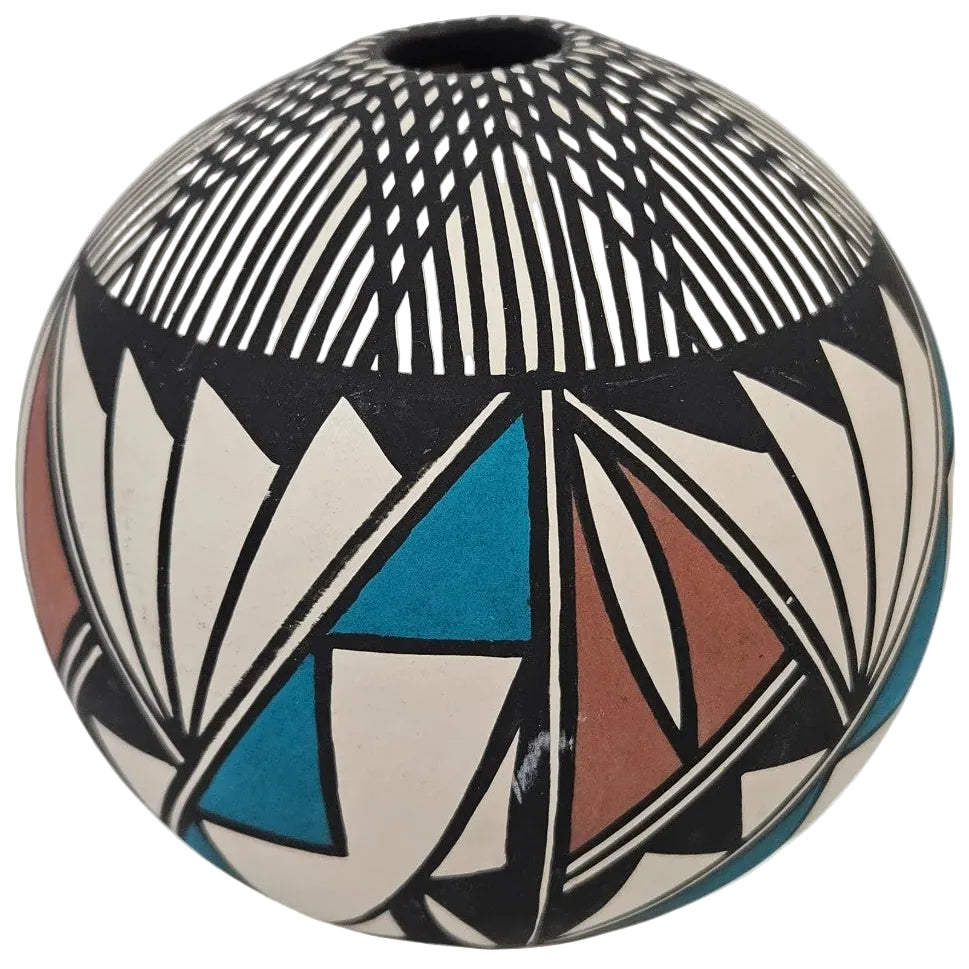 A hand-painted ceramic pot with a Southwestern geometric pattern, featuring black, white, blue, and terracotta red designs on a light gray background.