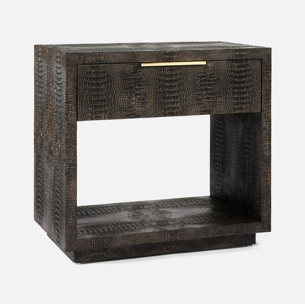 A modern dark brown textured nightstand with a single drawer, open center shelf, and a slim gold metal pull handle, shown on a light gray background.