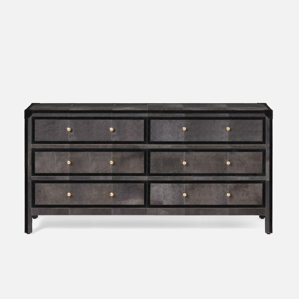 Black dresser with gold knobs on a white background