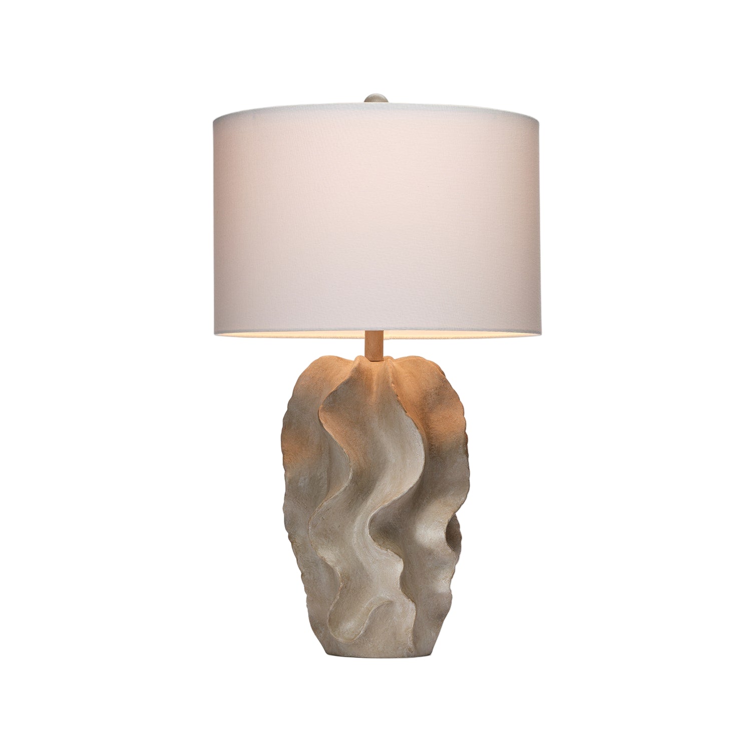 Table lamp with a textured base and white shade on a light gray background