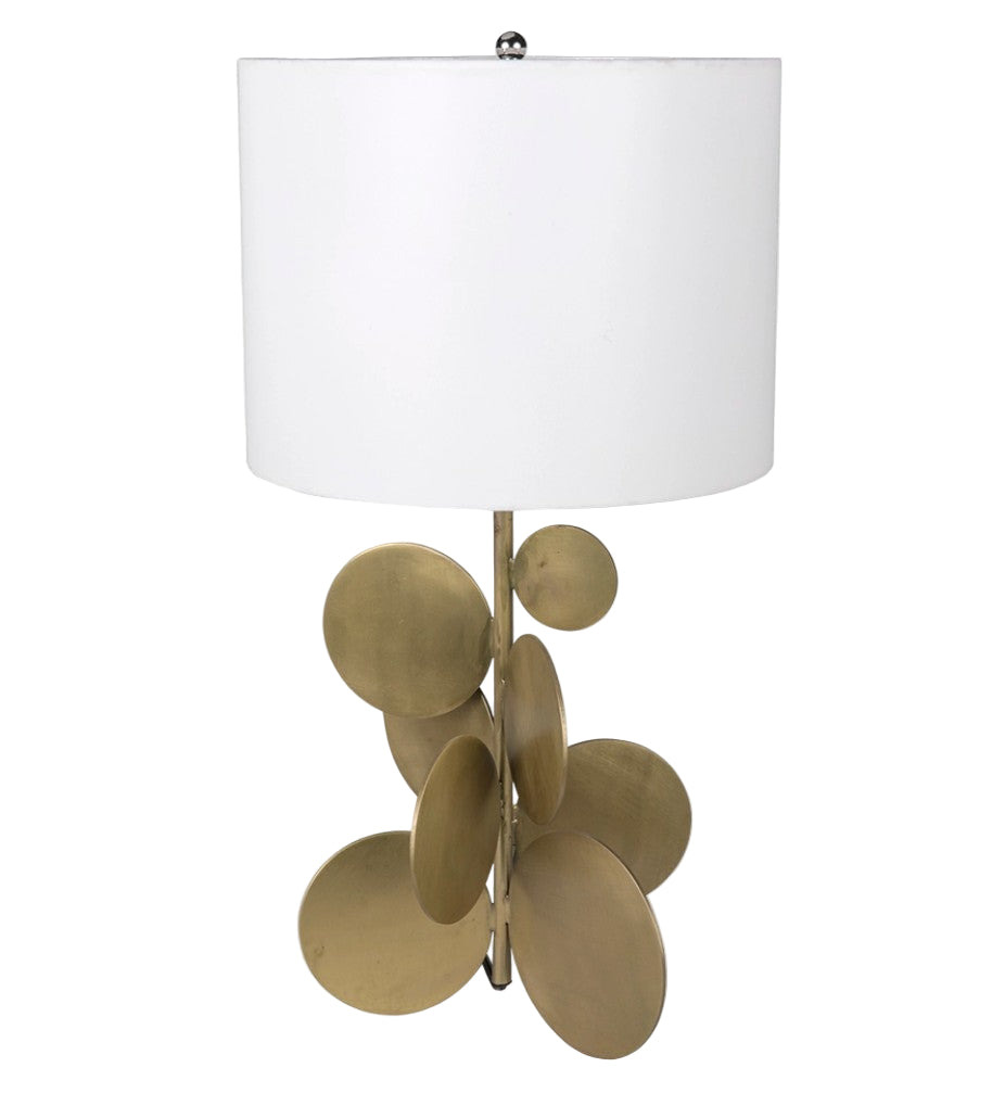 Decorative lamp with brass circular design on a white background