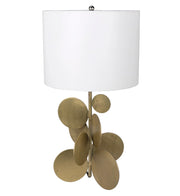 Decorative lamp with brass circular design on a white background