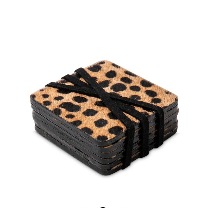 A stack of square leopard-print coasters tied with a black elastic band, shown on a plain white background.