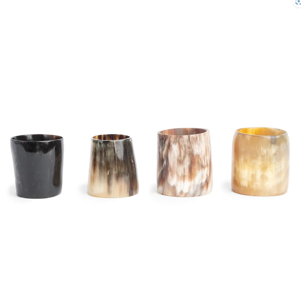 Set of four horn-shaped cups on a white background