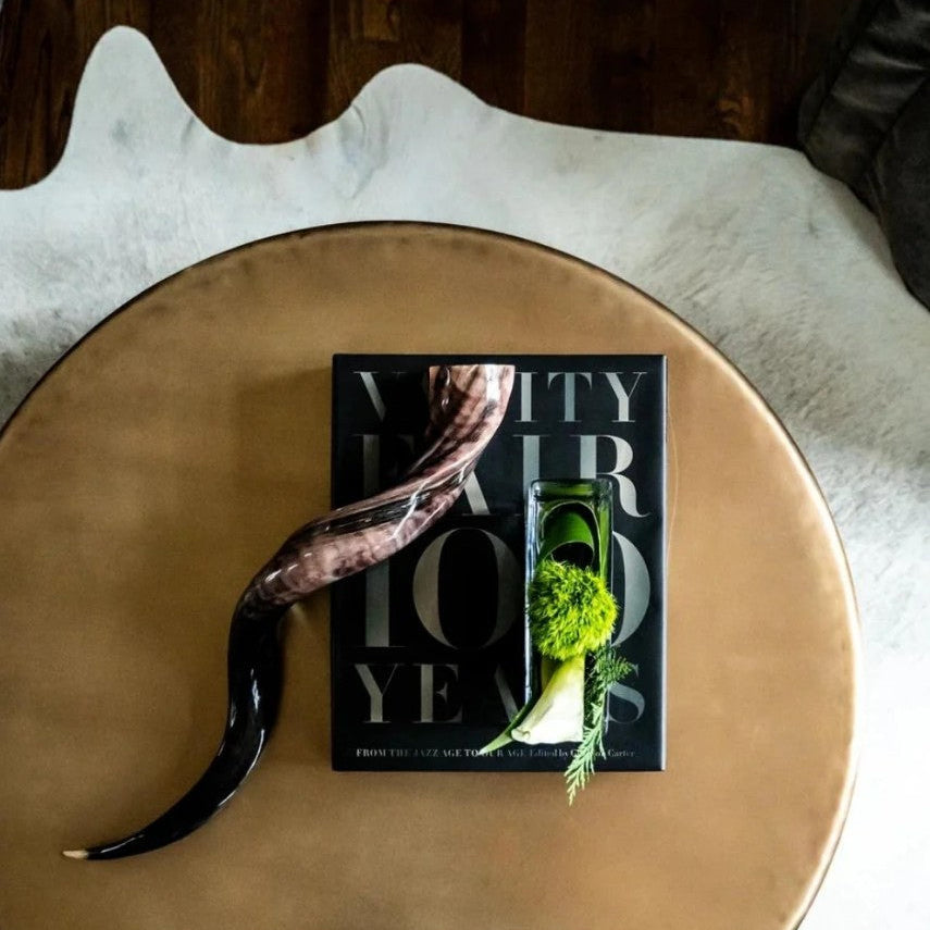 Book titled 'My Hair Today' on a round wooden table with decorative elements.