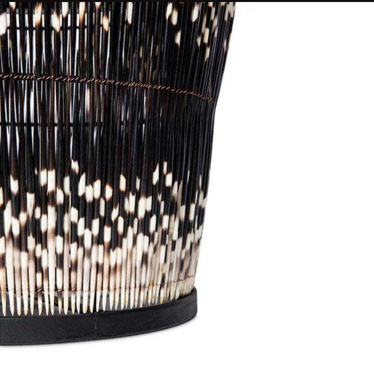 Close-up of a black and white patterned vase on a white background