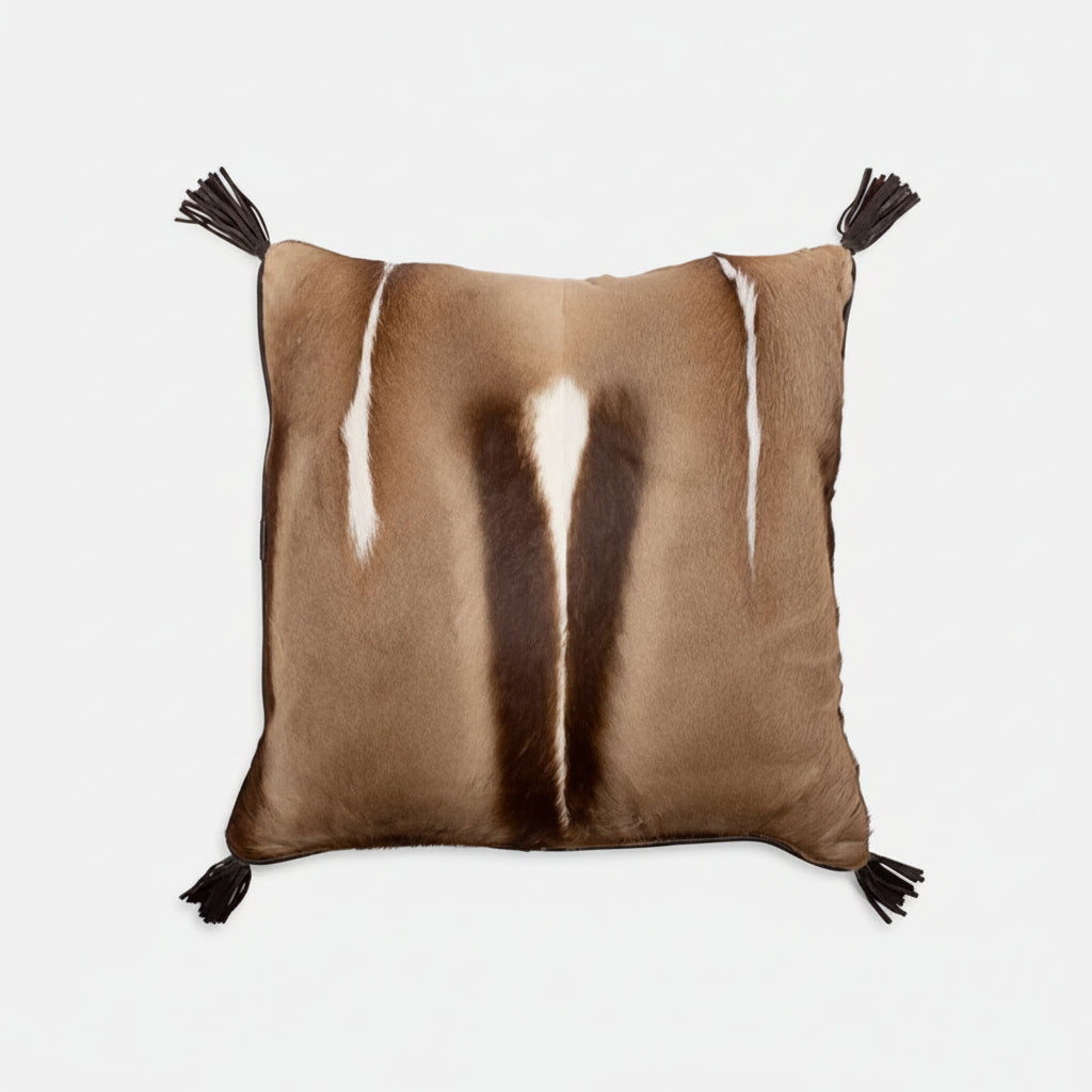 Brown pillow with white and black patterns on a white background