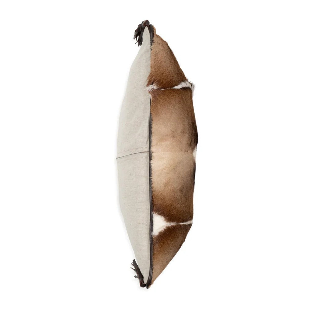Decorative pillow with brown and beige pattern on a white background