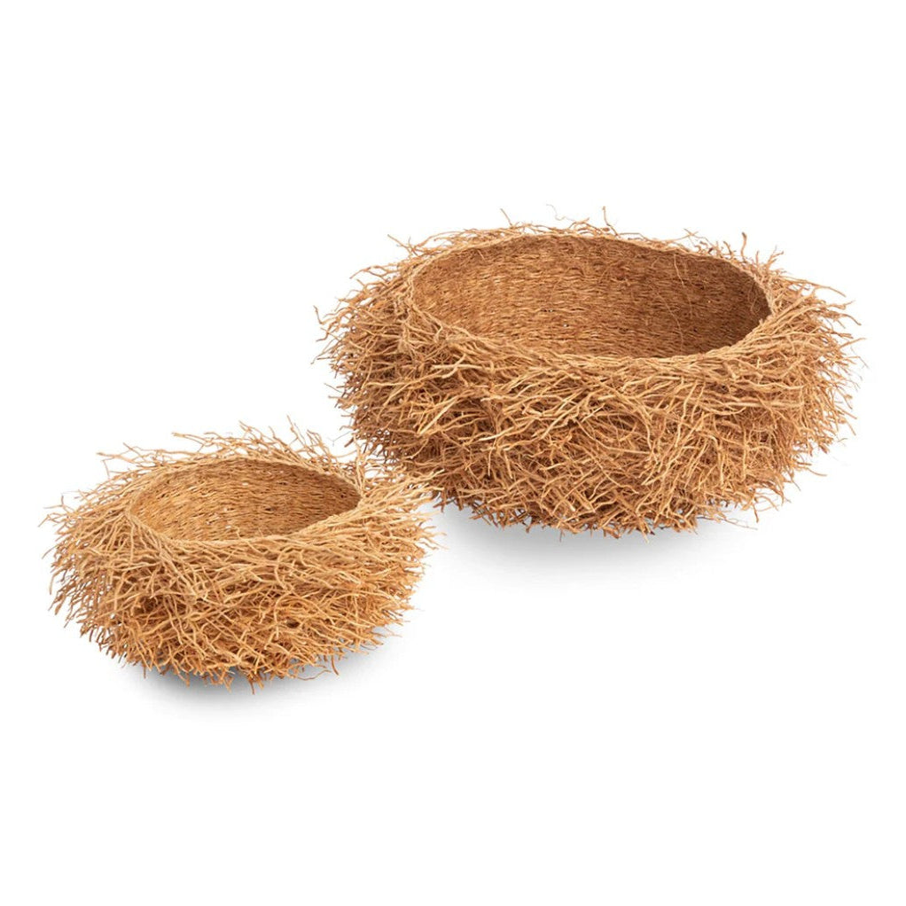 Two natural woven baskets on a white background