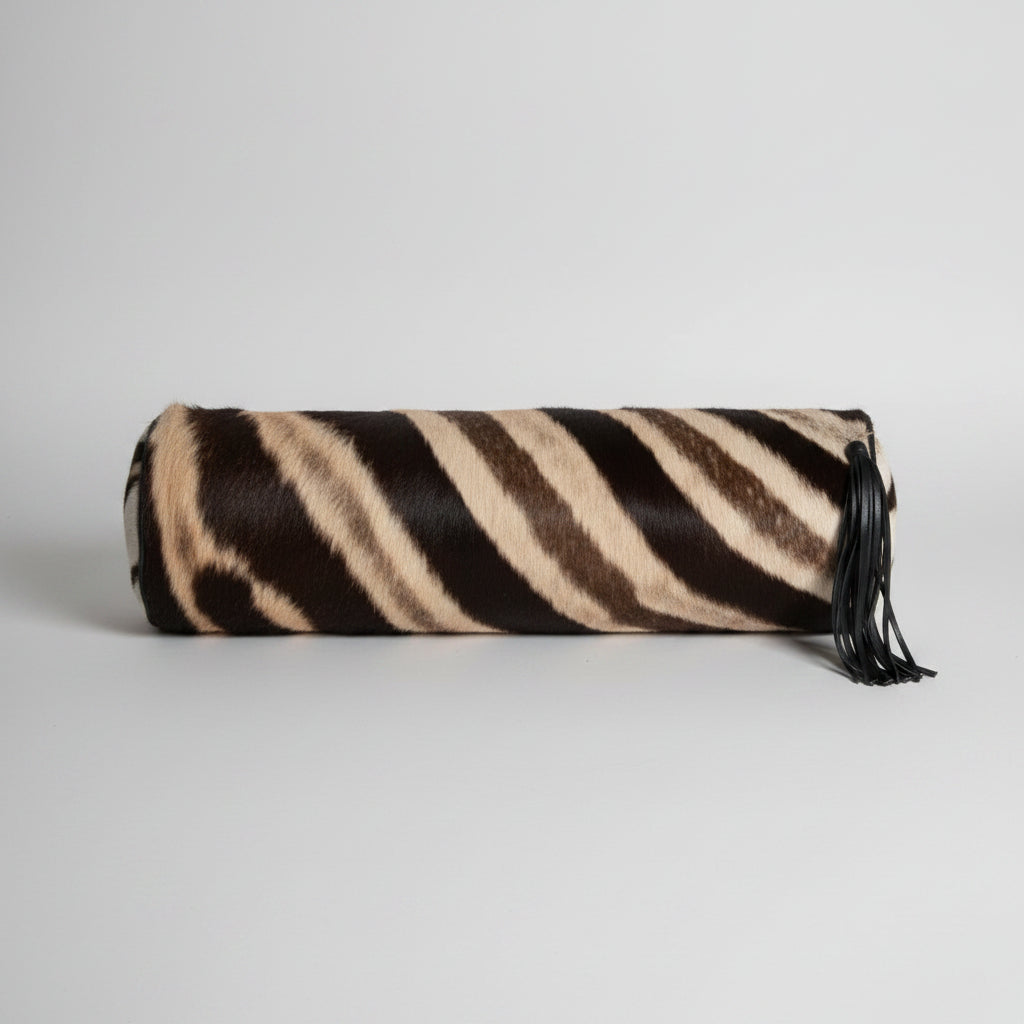 Zebra-striped clutch bag on a white background