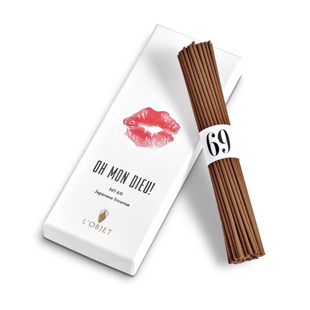 A bundle of brown incense sticks tied with a white band marked '69', placed next to its white packaging box featuring red lips and the text 'OH MON DIEU!'.