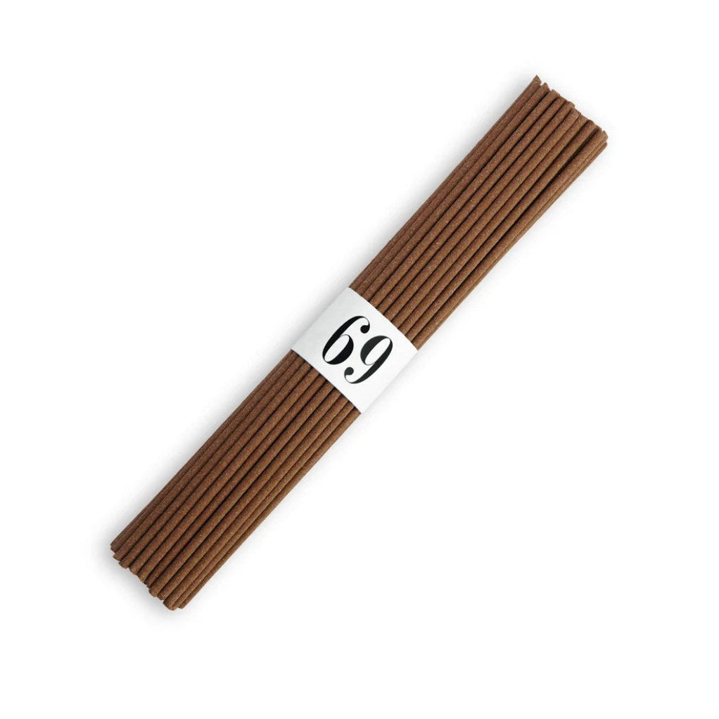 A bundle of brown incense sticks tied with a white paper band displaying the number '69' in black text, set against a plain white background.