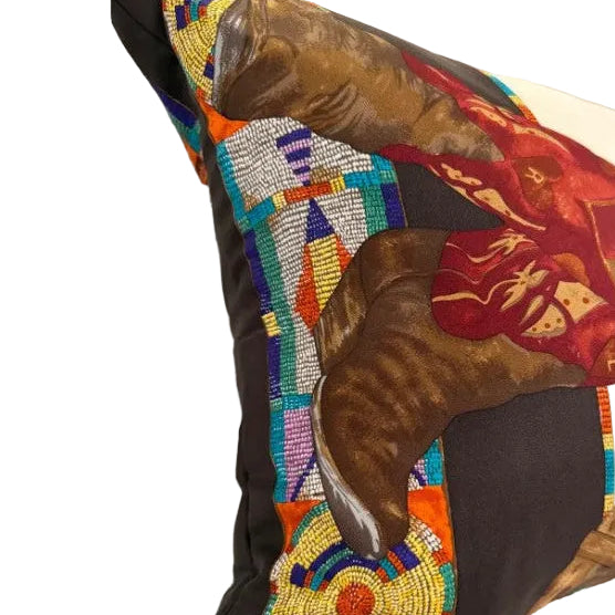 A square decorative throw pillow featuring a colorful, artistic print of a brown bear with red and orange details, set against a dark background with a multicolored geometric pattern on the side.