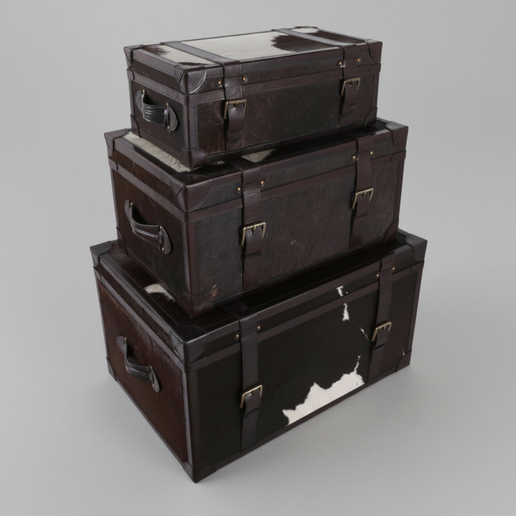 Stack of black storage boxes with metal clasps on a white background