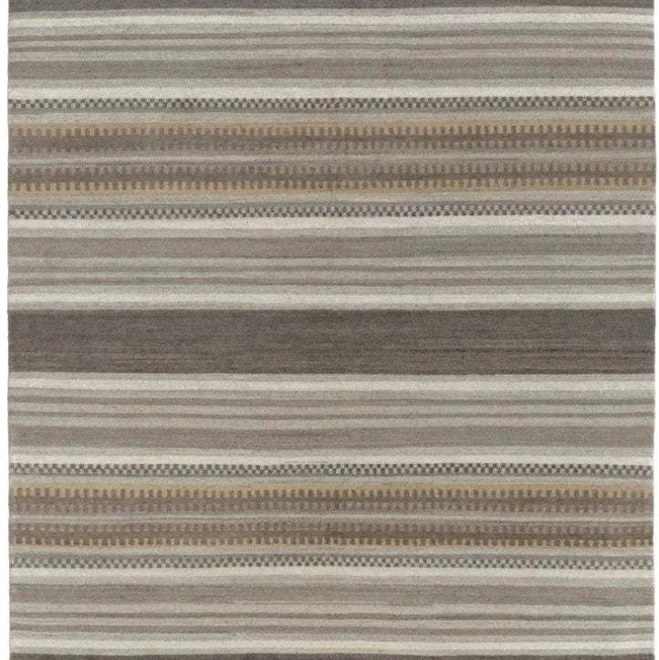 A rectangular area rug with a horizontal striped pattern in shades of gray, beige, and brown, featuring alternating solid and geometric textured bands.