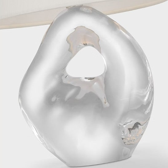 Decorative lamp with a unique, textured design on a white background