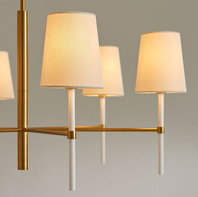 Chandelier with four lampshades on a neutral background