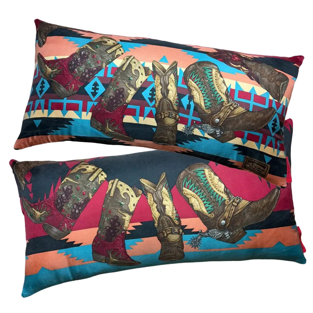 Two rectangular lumbar pillows with a colorful western boot print, displayed against a light gray background.