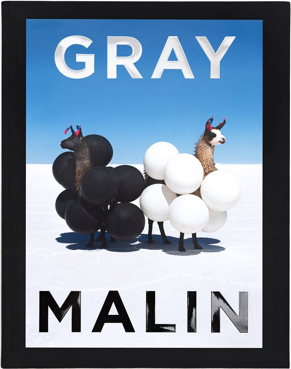 Artistic depiction of animals with balloons, featuring the brand 'Gray Malin'.