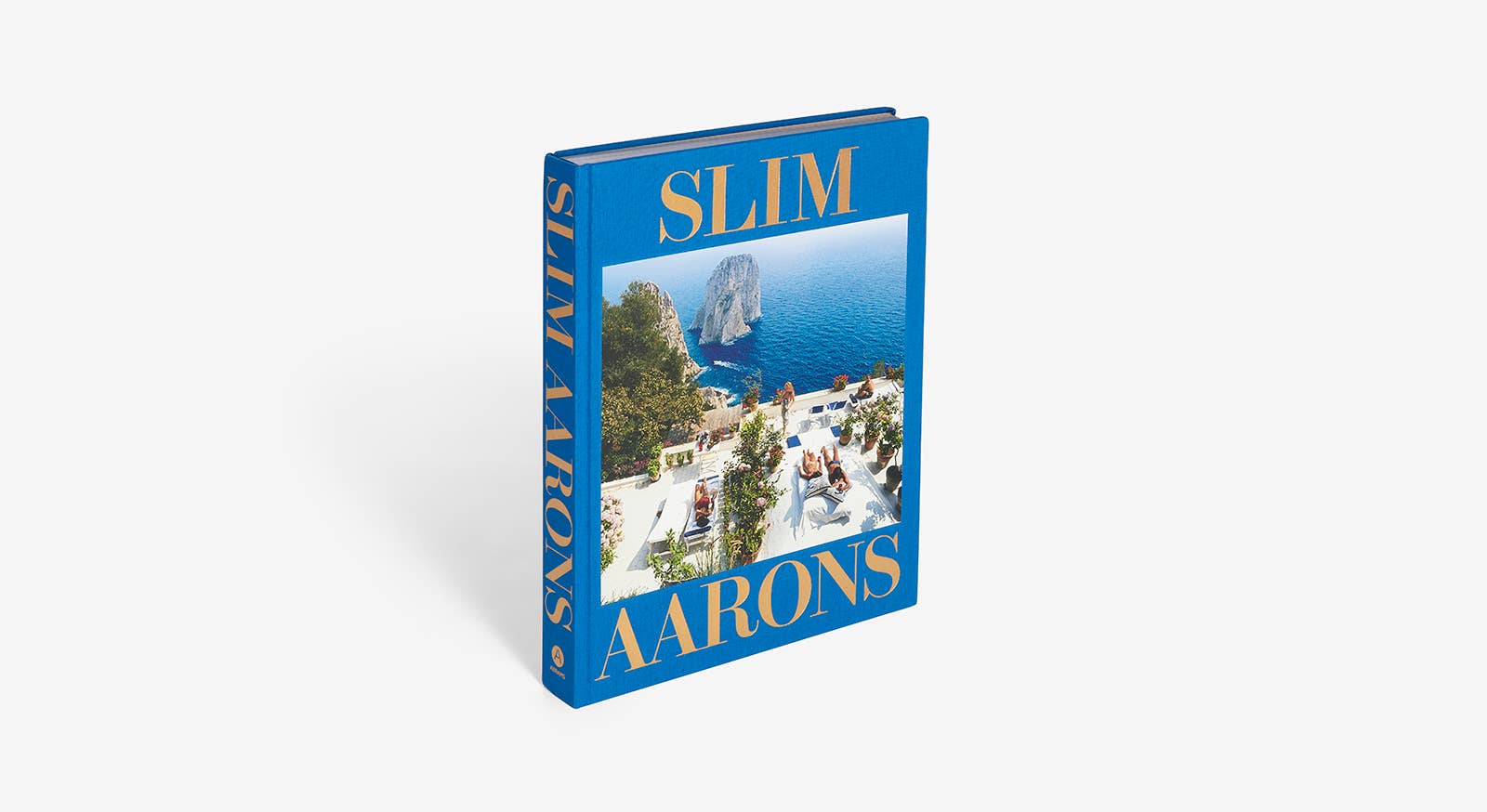 Blue book titled 'Slim Aarons' on a white background