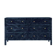 Blue textured dresser with gold knobs on a white background