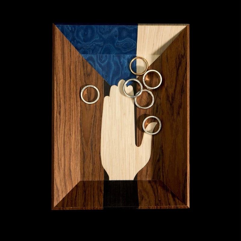 L'Objet Edgar Vide Poche top-down view showing intricate marquetry wood veneer pattern and hand motif
