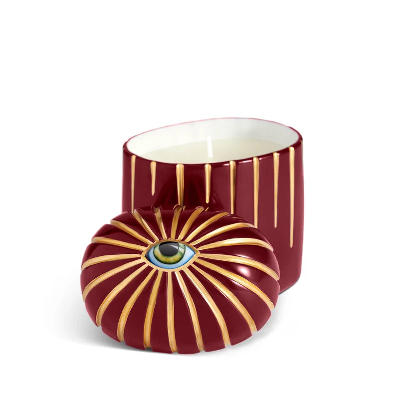 L'Objet Lito Candle Bordeaux angled view highlighting sculptural porcelain eye motif detail
