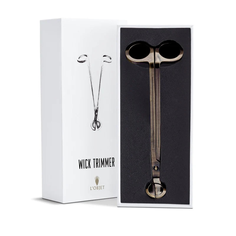 L'Objet Parfums de Voyage Wick Trimmer top view showing polished brass construction and curved blade detail