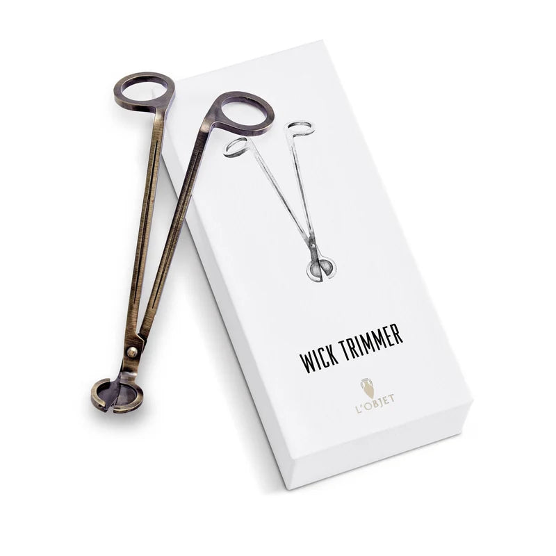 L'Objet Parfums de Voyage Wick Trimmer angled view highlighting refined brass finish and elegant silhouette