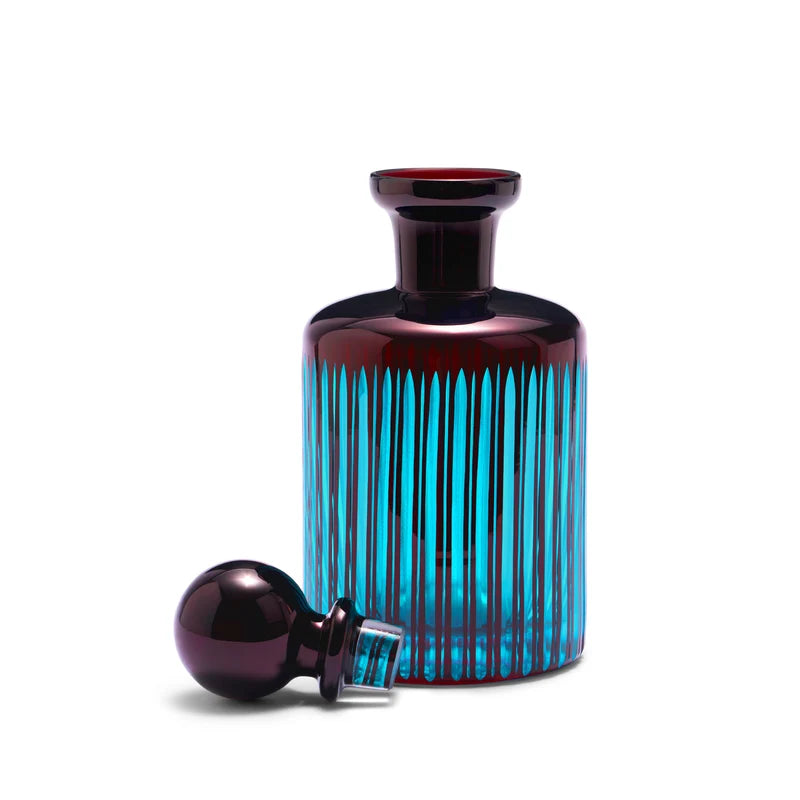 L'Objet Prism Decanter Bordeaux angled view showing deep red glass and light-refracting faceted detail
